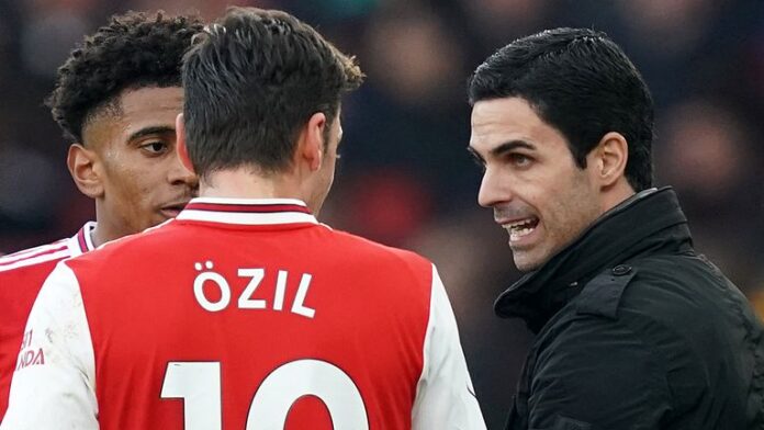 Arsenal title winner Paul Merson has called on manager Mikel Arteta to apologise to Mesut Ozil.
