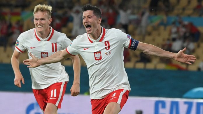Poland's Robert Lewandowski celebrates scoring against Spain