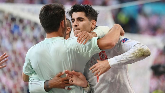 Spain's Alvaro Morata is congratulated after scoring his side's fourth goal