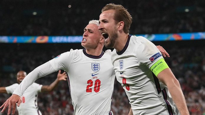 England's Harry Kane celebrates with Phil Foden after scoring in extra-time