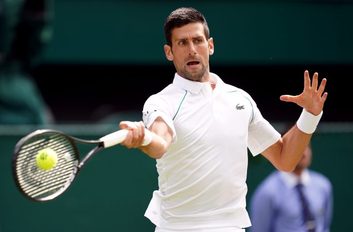 Novak Djokovic in action during the Gentlemen's Singles final against Matteo Berrettini on day thirteen of Wimbledon at The All England Lawn Tennis and Croquet Club, Wimbledon. Picture date: Sunday July 11, 2021.