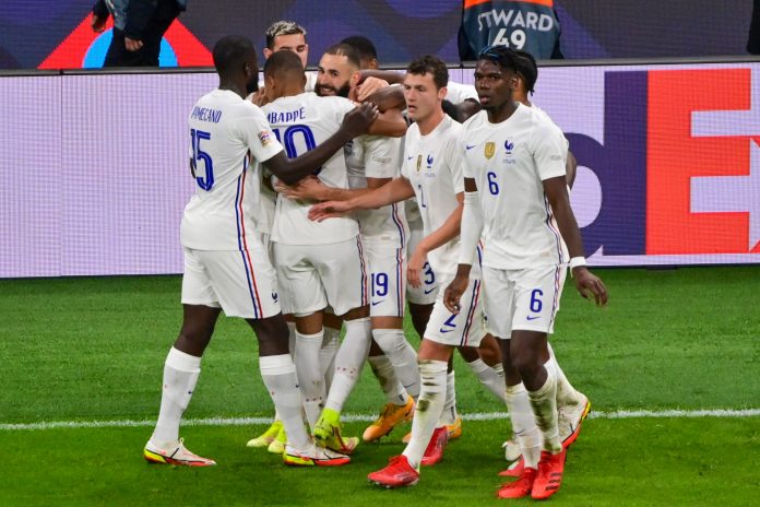 France's Karim Benzema is surrounded by teammates after scoring his team's first goal during the UEFA Nations League final soccer match between Spain and France at the San Siro stadium, in Milan, Italy, Sunday, Oct. 10, 2021. (Miguel Medina/Pool Photo via AP)