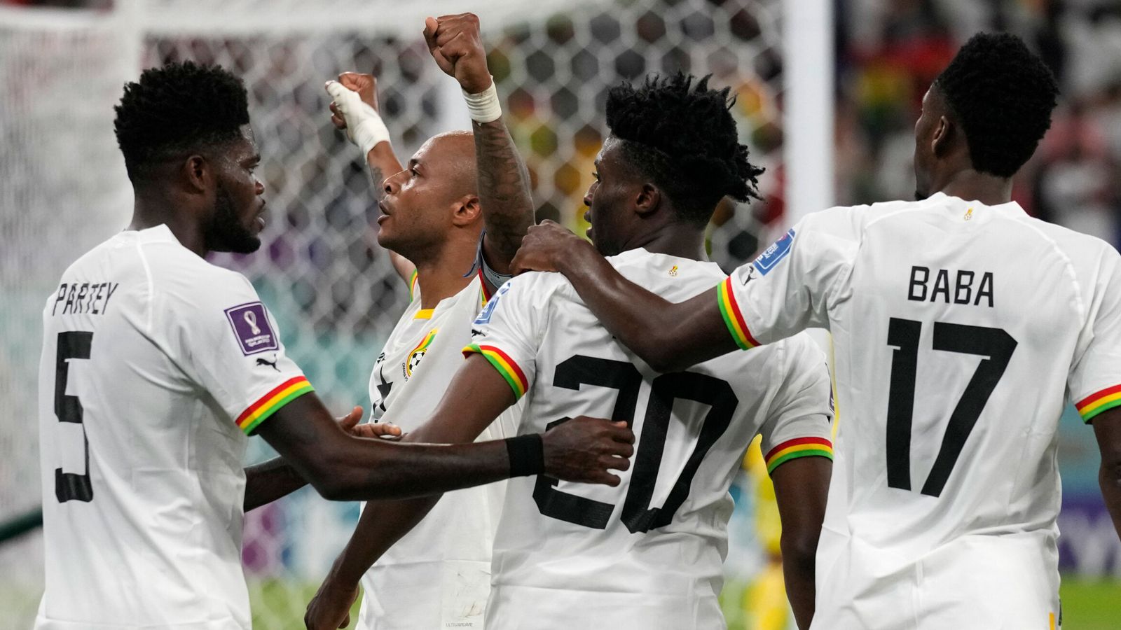 Andre Ayew celebrates with his team-mates after equalising for Ghana 