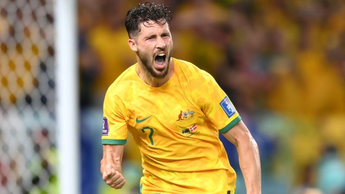 Mathew Leckie celebrates after giving Australia the lead against Denmark