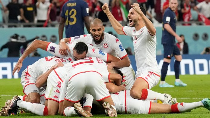 Tunisian players celebrate Wahbi Khazri's opening goal against France